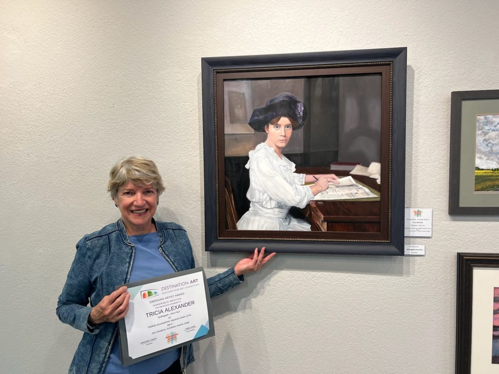 photo-of-Tricia-with-Honorable-Mention-certificate-Destination-Art-Show